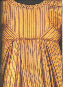 Woman’s dress of woven silk with applied plated trimming, lined with linen. British, about 1805.